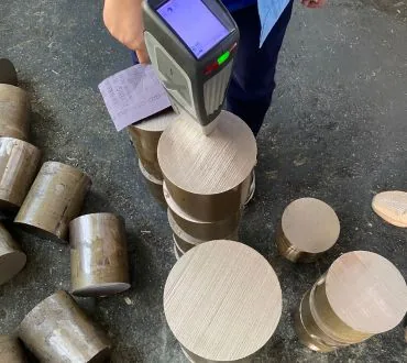 Handheld analyzer used on copper nickel bar stock