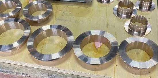 Machined copper nickel flanges on a shelf