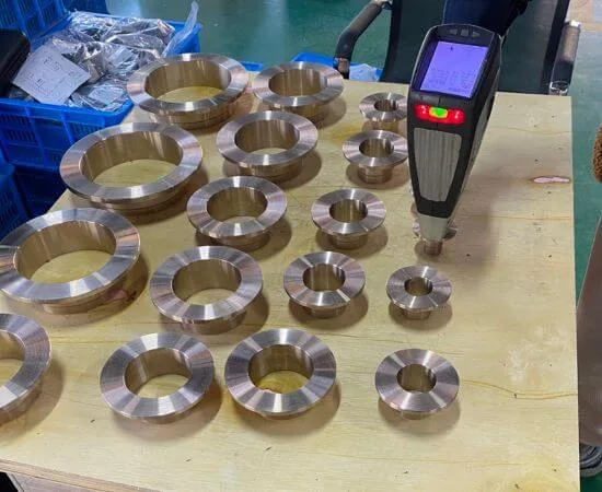 Handheld analyzer used for material identification on copper nickel flanges